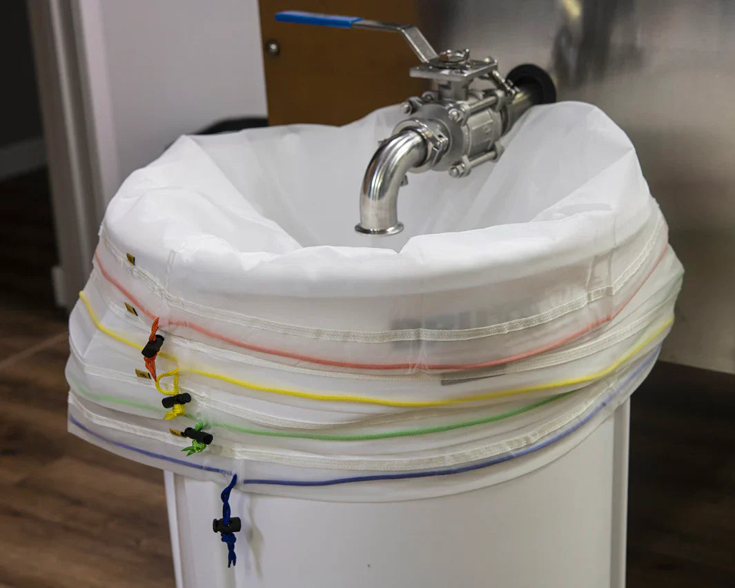 Bubble Hash Bags on a Brute trash can under the osprey hash washing system