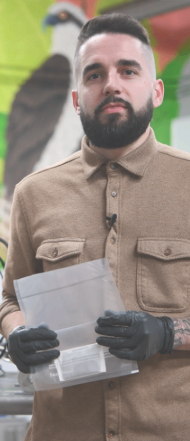 Cliff from Lowtemp Industries holding a hash washing bag in the lab