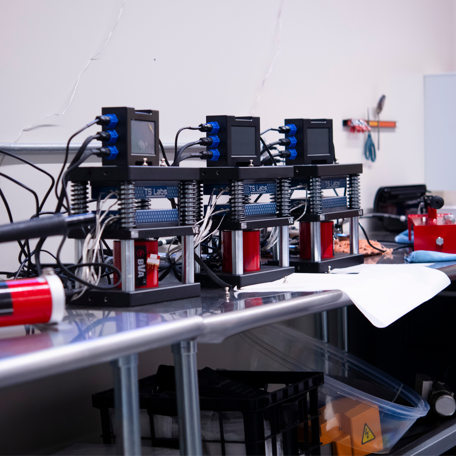 Medusa Rosin Press 3 Headed System from Lowtemp Industries with custom blue TS Labs plates on a stainless steel table