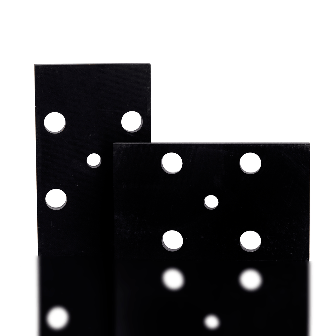 Two black sandpaper sheets with white holes on a white background