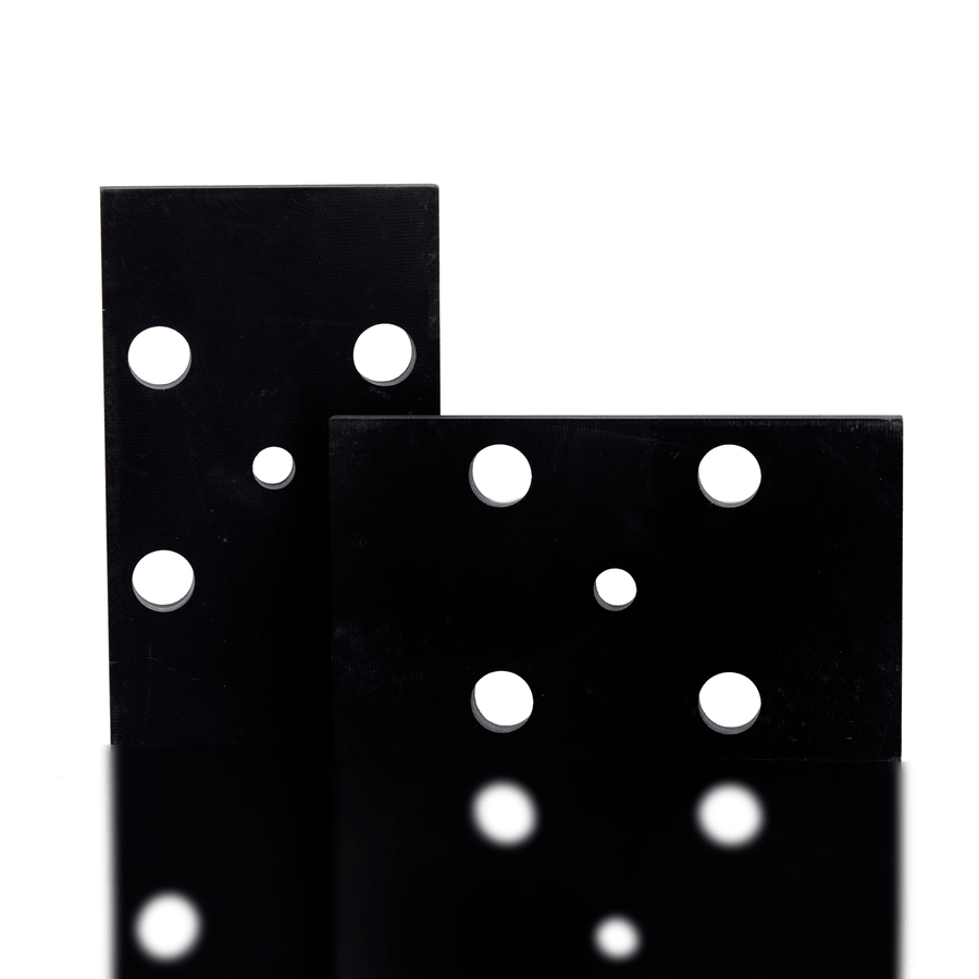 Two black sandpaper sheets with white holes on a white background