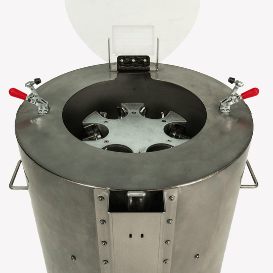 Metallic container with a central circular component on a white background