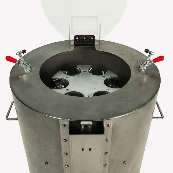 Metallic container with a central circular component on a white background