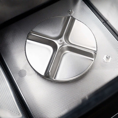 Metallic three-section cover on a textured surface