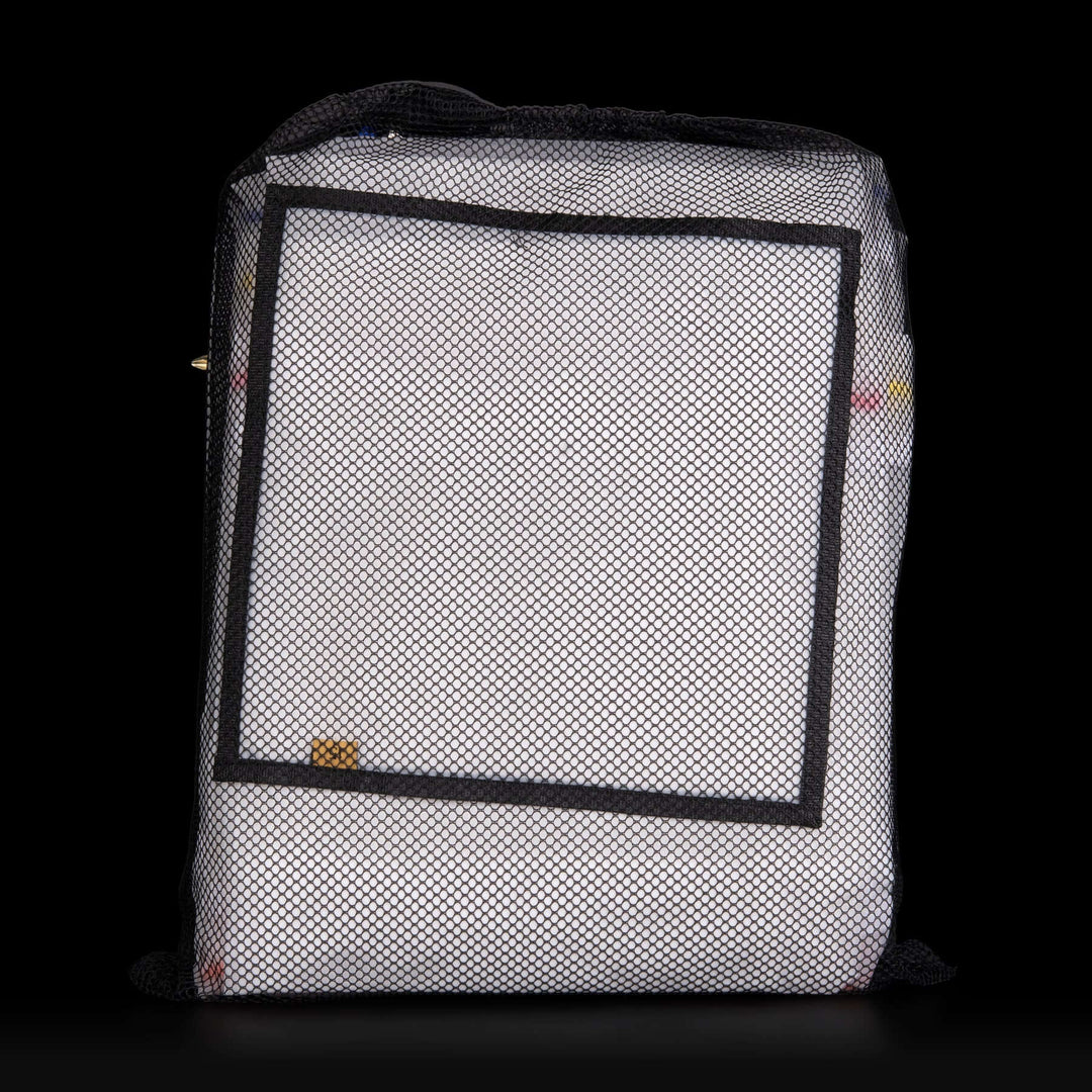 White mesh bag with black border on a black background