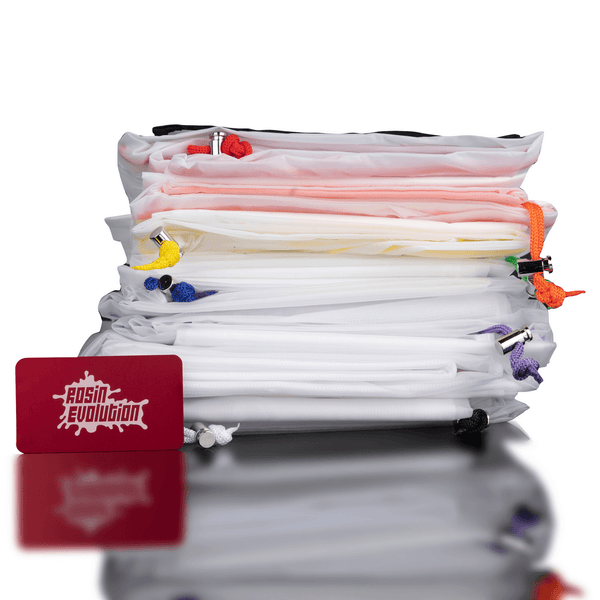 Stack of colorful tassels with a red card featuring 'Evolution' branding on a reflective surface.