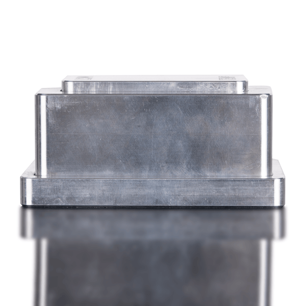 Metallic rectangular object with a reflective surface on a white background