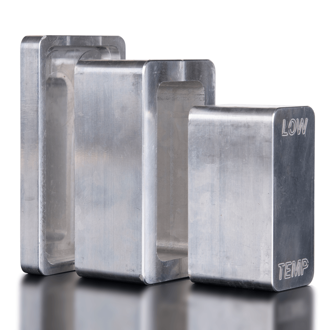 Three metallic blocks with 'TEMP' and 'LOW' labels on a reflective surface.