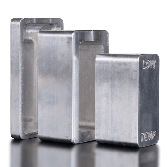 Three metallic blocks with 'TEMP' and 'LOW' labels on a reflective surface.