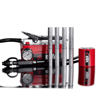 Red and black power tool with multiple components on a white background